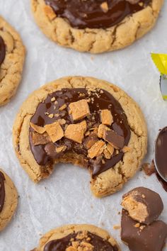 chocolate covered cookies with peanut butter on top