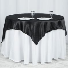 the table is covered with black and white linens