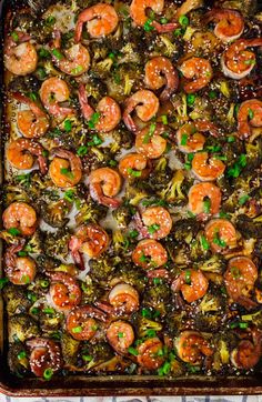 shrimp and broccoli casserole in a baking pan with green onions on the side