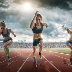 three women are running on a track in front of a stadium full of people and the sky is cloudy