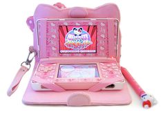 an electronic toy with a hello kitty theme on it's screen and keychain