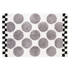 a rug with black and white circles on it