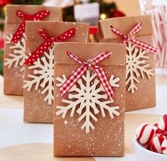 some brown paper bags with snowflakes on them