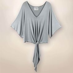 Feel Zenful in our relaxed, loose fitting, Tie Front Kimono. Each garment is adorned with an unique, inspirational sentiment. Our exclusive fabric is made from the softest Rayon/Spandex material. Our solid Stone fabric is a light, soft, airy, grey hue. One of a kind, CirclePai shape, exclusive, handmade, Rayon/Spandex Care:: Hand Wash Cold Kimono Sleeve Top, Diva Boutique, Tie Front Top, Boutique Store, Front Tie Top, Kimono Sleeve, Fashion Shoot, Fashion Stylist, Fashion Addict