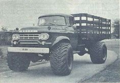 an old black and white photo of a monster truck