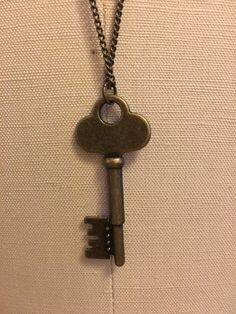 "Bronze key on a bronze chain necklace Key is 2\" in length Chain necklace is 30\" in length" Bronze Brass Necklace With Keys, Bronze Chain Necklace, Astoria Ny, Necklace Outfit, Bronze Necklace, Charm Necklaces, Key Necklace, Book Inspiration, Tumbling