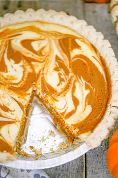 a pumpkin pie with a slice missing from it