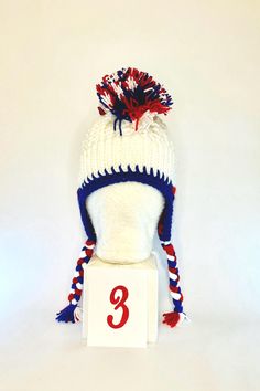 #1 LET'S GO BUFFALO!  Looking to level up your tailgating swag??? This is a one of a kind handmade (crochet) Buffalo football mohawk winter hat! It is made with doubled thick yarn to keep you warm from the pregame tailgate through the post-game VICTORY party! These hats are super cozy to protect you from the whipping winds and cold temps all football season.  Each hat is slightly different because they are all handmade. Each hat is made close to 22 inches in diameter around the largest part of my forehead. The band is crocheted to have some give to it, like elastic to allow each hat to fit multiple head sizes.    Please note these are custom made and I only have the number listed in stock. Crochet Buffalo, Buffalo Football, Crochet Unique, Thick Yarn, Football Season, Winter Hat, Handmade Crochet, Caps Hats, Buffalo