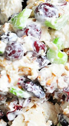 a salad with grapes, celery and cheese on it is ready to be eaten