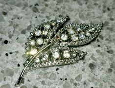 Lovely high quality silver tone vintage pin rhinestone brooch from the 1950s, leaf floral shape. Perfect condition, heavy weight, pin clasps securely. 1.25x2.50 Ships free domestic, next day. Gift Costume, Cocktail Gifts, Cocktail Outfit, Cocktail Attire, Diamond Gift, Brooch Vintage, Rhinestone Brooches, Vintage Pins, Gift Wedding