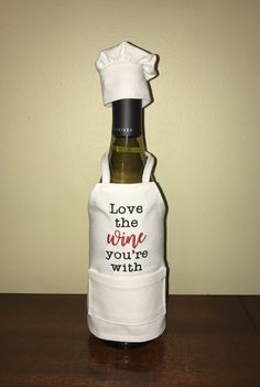 a wine bottle with a chef's hat on it and the words love the wine you're with