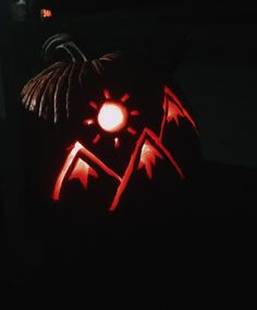 a carved pumpkin with an evil face on it