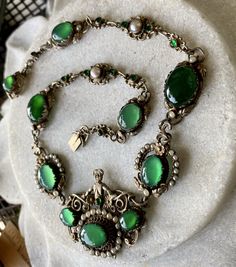 "Stunning Circa 1800s Victorian Austro Hungarian Green Chrysoprase Pearl Silver Gilt Royal Crown Antique Necklace Measures aprox 16 1/2\" Around Weighs 45.8 grams See pictures next to ruler fro scale has been tested and tests silver Although this is Hungarian pice it has a very unique Italian peruzzi feel" Victorian Green Jeweled Jewelry, Victorian Green Jewelry With Jewels, Green Victorian Necklace For Wedding, Victorian Oval Green Necklace, Antique Green Jeweled Necklace, Antique Green Jeweled Necklaces, Ornate Green Oval Necklaces, Vintage Green Emerald Necklace For Formal Occasions, Antique Green Necklaces For Weddings