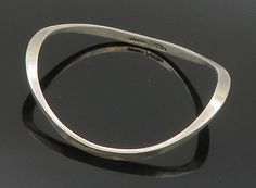 "MEXICO 925 Sterling Silver - Vintage Smooth Curved Bangle Bracelet - BT6235  MEXICO 925 Sterling Silver - Vintage Smooth Curved Bangle Bracelet - BT6235  Jewelry Type:         Bracelet   Metal Type:            925 Silver   Metal Size:             7.5\"  Stone Type:            N/A  Condition:              N/A  Jewelry Weight:     18.3 Grams  PLEASE NOTE: THIS ITEM IS PRE-OWNED. ALTHOUGH MOST ITEMS ARE IN VERY GOOD CONDITION, SOME MAY NEED CLEANING AND/OR MINOR REPAIRS. WE MAKE A VERY STRONG EFFORT TO UPLOAD CLEAR PICTURES. PLEASE INSPECT ALL PICTURES AND ASK ALL QUESTIONS YOU MAY HAVE PRIOR TO MAKING A PURCHASE. NOT ALL STONES ARE GENUINE, SOME ARE ENHANCED OR CREATED." Sterling Silver Modernist Bangle, Contemporary Sterling Silver Bangle As Gift, Modernist Sterling Silver Bangle Gift, Contemporary Sterling Silver Bangle Bracelet Gift, Modernist Sterling Silver Bracelet As Gift, Modernist Sterling Silver Bracelet Gift, Modernist Sterling Silver Bangle Bracelet Gift, Bracelet Metal, Beautiful One