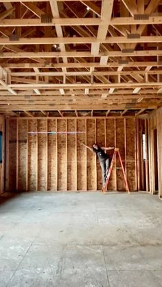 an unfinished room with wooden framing and walls