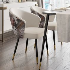 three pink chairs sitting next to each other on top of a hard wood floored floor