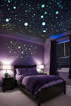 a bedroom with purple walls and green glow stars on the ceiling, along with black curtains