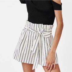 Brand New With Tags! This Pair Of Black And White Striped Shorts Comes With A Tie Belt And Side Pockets. It Is A Perfect Pair To Wear With A Basic Body Hugging Or Tight Top For That Simple Yet Elegant Look. The Material Of This Holds The Shape Well So It Is Good For Office/Formal Wear As Well. The Waist Is Elastic, Fits 26 - 27in Waist. Chic Striped Bottoms, Chic Striped Bottoms For Vacation, Chic Striped Bottoms For Beach, Chic Summer Cotton Bottoms, Chic High Waist Bottoms For Brunch, Chic High-waist Bottoms For Brunch, Chic Short Bottoms For Summer, Trendy White Shorts For Workwear, Chic High-waisted Shorts For Summer