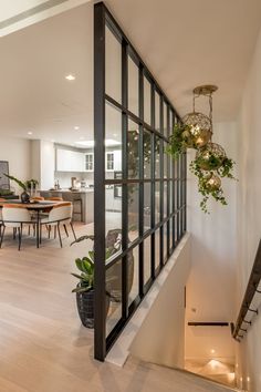 an open floor plan with stairs leading up to the dining room