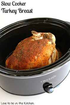 slow cooker turkey breast in the crock pot with text overlay reading slow cooker turkey breast low to be in the kitchen