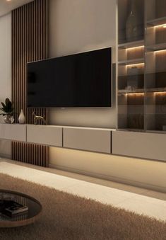 a large flat screen tv mounted to the side of a wall in a living room