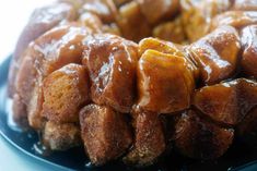 a bundt cake with caramel topping on a blue plate