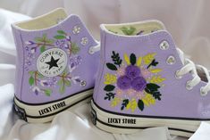 "Experience the art of hand embroidery on Converse embroidered shoes, a testament to meticulous craftsmanship." Custom embroidery converse sneakers/Bridal flower embroidered shoes/Converse purple chuck taylor 1970s/Personalized wedding date and name   💸 Price includes Converse Shoes and floral embroidery as shown 🌸 You can send me your Converse/Vans shoes or I can buy them for you. We stock all the Converse and Vans shoes you want, if you want other Converse/Vans shoes in the store, please message us. Your embroidered Converse/Vans shoes will be available for shipping in 7-15 days. 🌸 I started hand embroidering on fashionable clothes and handbags over 20 years ago - and now on CONVERSE/VANS shoes, an American icon, a must-see classic! I'm excited to give your Chuck Taylor shoes a new lo Pink Converse Embroidery, Light Purple Converse Embroidered, Floral Embroidered Converse, Spring Floral Embroidery Converse Sneakers, Converse Lace-up Sneakers With Floral Embroidery, Embroidered Shoes Converse, Chuck Taylor Shoes, Embroidered Converse, Custom Converse