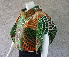 African Print  Top, Women's Blouse  100% Cotton Dimensions:  Length: approximately 21 1/2 inches long from top of shoulder to midriff                           SIZEBUSTWAIST 14          42           36 16          44           38 18          46           40 20          48           42 This item features bold, beautiful colors  Simple, elegant, laid back style perfect for easy Summer dressing Simply slip over your head and go!  Wear with jeans, fitted pencil skirt or trousers Care Instructions: Can be Hand washed. Dry Clean recommended. Do not use bleach. Handmade.  Made to order. This is a loose fitting blouse and is designed to hang on the body The item you will receive may vary slightly depending on the fabric placement. The colors remain the same. African Print Tops With Jeans, African Print Blouse, Tops With Jeans, African Print Top, African Print Tops, Summer Dressing, Simple Summer Dresses, Butterfly Blouse, African Prints