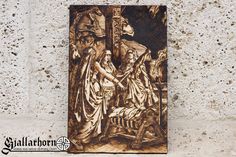 a wooden plaque depicting the birth of jesus