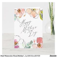 a greeting card with watercolor flowers and the words happy mother's day on it