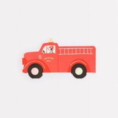 a red fire truck with a dog on the top is sitting in front of a white background