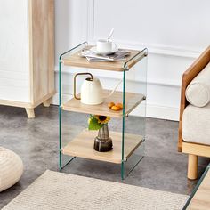 a glass table with a tea pot on it