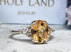 Don't miss this opportunity to own this beautiful gemstone ring crafted in 14k gold filled => Gemstone Type - Citrine, Clear Quartz => Gemstone Cut - Faceted => Gemstone Size - 8*10 mm, 2 mm => Total Number of Gemstones - 7 => Metal Type - 14k Gold Filled (Tarnish Resistant And Nickel Free) - also available in 925 sterling silver * Please contact me for pricing on a sizes larger than 11 * ~ Feel free to ask me about custom made designs. ❏ Replacements and custom orders : ✪ 925 ste Oval Topaz Rings With Vs Clarity, Oval Yellow Gold Crystal Ring With Center Stone, Gold Oval Crystal Ring With Center Stone, Oval Citrine Promise Ring, Oval Citrine Diamond Promise Ring, Oval Birthstone Ring With Vs Clarity In 14k Gold, Oval Citrine Ring With Prong Setting, Oval Citrine Diamond Ring With Accent Stones, Gold Oval Topaz Crystal Ring