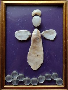 an image of a man made out of rocks and stones on a purple background with gold frame