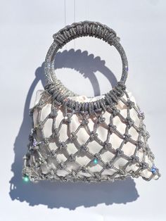 The PRINCESS Crystal Rhinestone Handbag  This beautiful handbag is handwoven in thousands of pave crystal rhinestones.  Included is a beautiful matte satin lined drawstring bag. We offer different colors and bundles of insert so you can exchange them and your your total look according to your outfit and occasion. Insert colors: - Black  - Cobalt Blue - Off White  - Light Pink - Fuchsia - Multicolor (limited quantities) - Your custom color (add one week to ship) Bundle is available for three colo Luxury Silver Bag With Pearl Handle, Silver Party Bag With Round Handle, Elegant Rhinestone Tote Shoulder Bag, Elegant Rhinestone Tote Bag, Silver Top Handle Bag For Wedding, Silver Top Handle Evening Bag For Wedding, Elegant Handmade Bags With Round Handle, Elegant Silver Evening Bag With Top Carry Handle, Elegant Silver Evening Bag With Top Handle