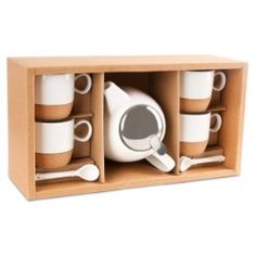 a wooden box filled with coffee cups and saucers