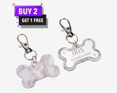 two key chains with a dog bone on one side and an irs tag on the other