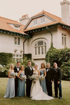 a group of people standing in front of a building