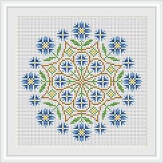 a cross stitch pattern with blue and yellow flowers in the shape of a flower on a white background