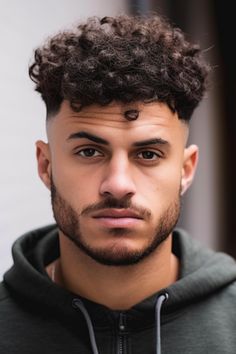 If you have thick hair, opting for curly hair on top with a low taper fade is an excellent decision. With this fade haircut, your curls will flourish on the top while keeping a fade on the sides. Click here to check out more handsome low taper fade haircuts for men.