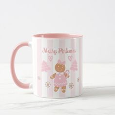 a pink and white coffee mug with a teddy bear on the front, merry christmas