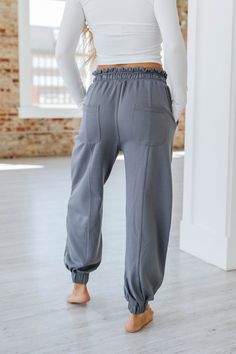 Elevate your wardrobe with our Harvey Lace-up Waist Harem Pants! Crafted with a unique lace-up waist design, these pants not only provide a stylish touch but also offer a comfortable fit. Perfect for any occasion, our harem pants will make you stand out from the crowd. Upgrade your style today! Model Info: Models are 5'7", Size 2, wearing smalls Material: 65% Polyester + 35% Cotton Sizes Trousers_Waist Hip Bottoms Inseam Outseam Relax Relax Relax Relax Relax S 25.6 44.9 27.8 26.7 39.8 M 27.6 47. Baggy Drawstring Bottoms For Athleisure, Baggy Athleisure Bottoms With Drawstring, High-waist Cotton Joggers With Drawstring, High Waist Cotton Joggers With Drawstring, Fitted Cotton Drawstring Pants, Relaxed Fit Bottoms With Drawstring For Fall, High-waist Sweatpants With Drawstring, Gray Full Length Drawstring Bottoms, High Waist Solid Color Sweatpants With Drawstring