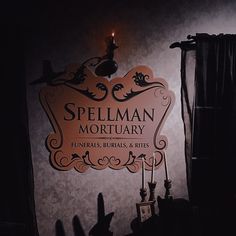 there is a sign that says spellman mortary funerals, burns & rites