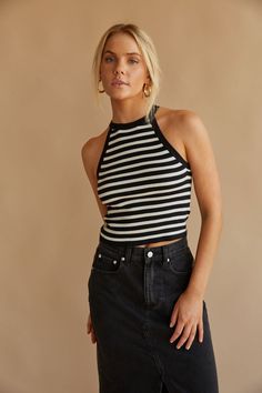 You'll look so cute in the Cheyenne Striped Halter Tank Top! This black and white striped top is made of a ribbed material and features a halter neck and cropped fit. Pair with the Hayden Light Wash Denim Midi Skirt to complete the look! homecoming dresses | hoco dresses | unique homecoming dresses | homecoming dress | hobo dresses | mini dress | unique hobo dresses | mini dresses | gamed outfits | mini dress formal | coastal cowgirl outfits | coastal cowgirl High School Clothing, Black And White Striped Top Outfit, Striped Tank Top Outfit, Hobo Dress, Striped Top Outfit, Halter Tops Outfit, Unique Homecoming Dresses, Black And White Striped Top, Striped Halter Top