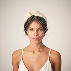 a woman wearing a veil over her head