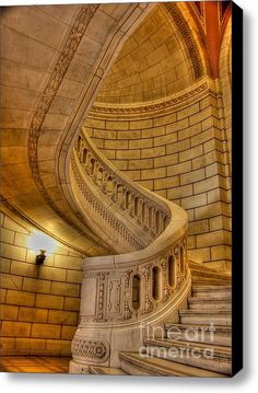 a spiral staircase in an old building metal print