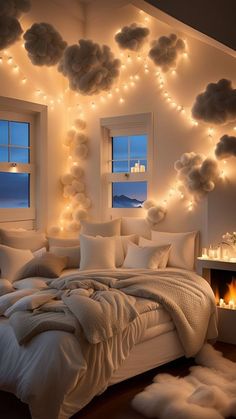 a bedroom decorated in white with lights on the ceiling and fluffy fur rugs around the bed