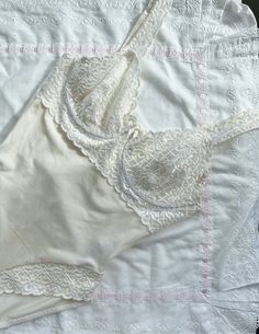 Label size: 85C EUR (38B US) Material: nylon, elastane Features stunning lace, small bow detail, underwired cups, adjustable straps and snap gusset. The fabric is very stretchy and soft. Good condition with some slight signs of wear on holes for snaps (pictured). Summer Fitted Bodysuit With Lace Top, Fitted Summer Bodysuit With Lace Top, Fitted Sleeveless Lace Bodysuit, Summer Lace Top Fitted Bodysuit, Fitted Sleeveless Delicate Lace Bodysuit, Fitted Lace Top Bodysuit For Summer, Stretch Lace Bodysuit With Lace Trim, Lace Lined Fitted Bodysuit, Fitted White Bodysuit With Built-in Bra