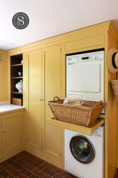 yellow utility, launry room, laundry basket pull out Laundry Room Yellow, Mustard Utility Room, Walk In Pantry And Laundry, Laundry In Cupboard, Yellow Utility Room, Yellow Laundry, Yellow Mudroom, Yellow Laundry Room, Yellow Cupboards