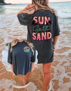 Sun Salt Sand T Shirt, Life's A Beach Tshirt, Beach Tee, Comfort Colors Tee, Oversized Tee, Palm Tree Summer Tshirt, Coconut Girl, Vacation Shirt, Women's Graphic Tees Gildan is back with its garment-dyed t-shirt, a fully customizable tee made 100% with ring-spun cotton. The soft-washed, garment-dyed fabric brings extra coziness to your wardrobe while the relaxed fit makes it an excellent daily choice. The double-needle stitching throughout the tee makes it highly durable while the lack of side-seams helps the shirt retain its tubular shape. *Production Notes* ~All shirt designs are made using Direct to Garment (DTG) printing. This is not a vinyl product. ~This is a Comfort Colors unisex, relaxed fit tee. For an oversized tee, please size up. If you are looking for an oversized T-shirt Dre Oversized Vsco Crew Neck T-shirt, Black Letter Print T-shirt For Beach Season, Oversized Summer T-shirt With Letter Print, Oversized Crew Neck Summer T-shirt, Oversized Screen Print T-shirt For Beach Season, Graphic Tee With Letter Print For Beach Season, Beach Season Relaxed Fit Crew Neck T-shirt, Relaxed Fit Crew Neck T-shirt For Beach Season, Black Text Print T-shirt For Vacation